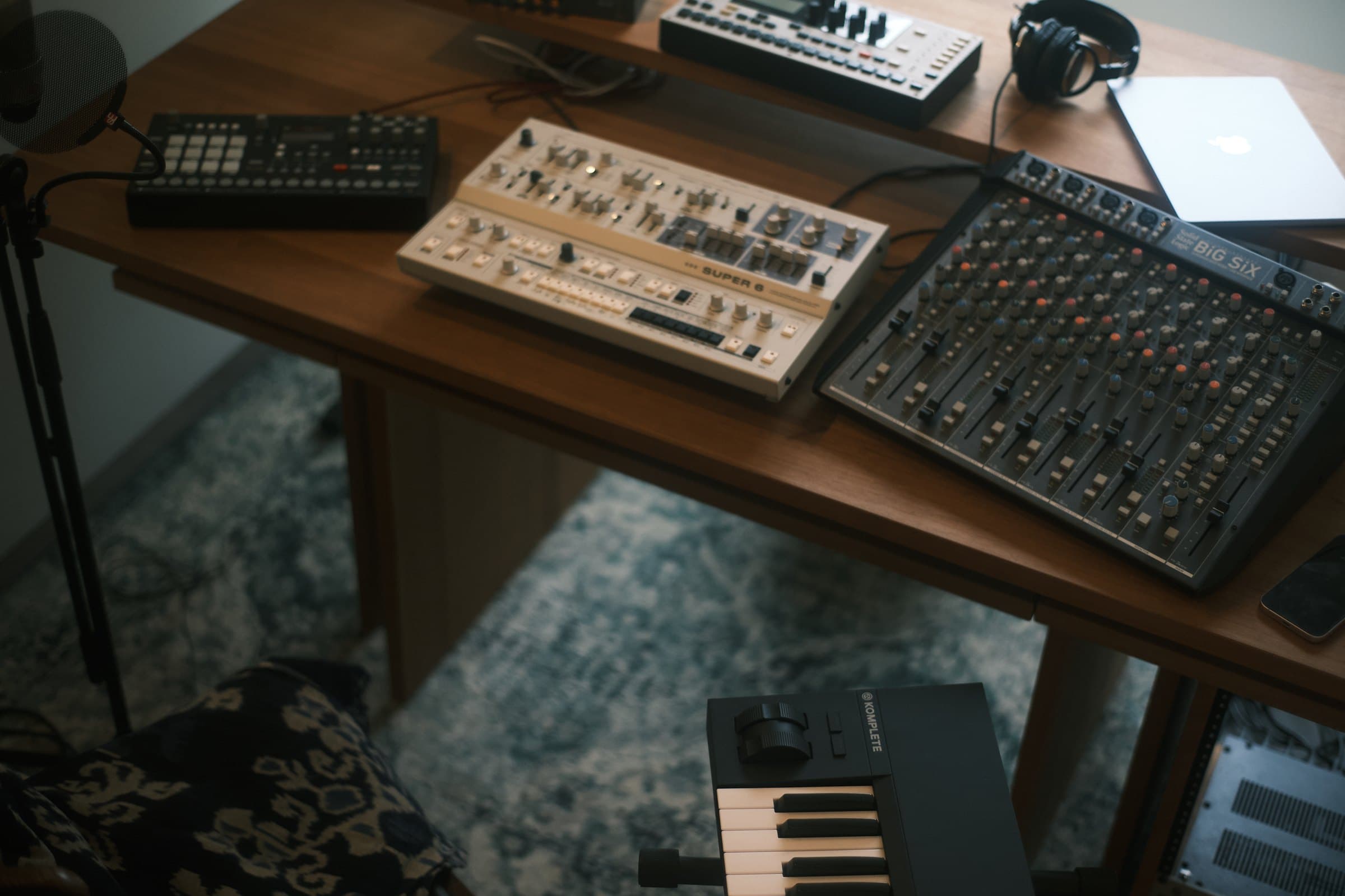 Synthesizers and SSL Big Six mixing console on the studio desk