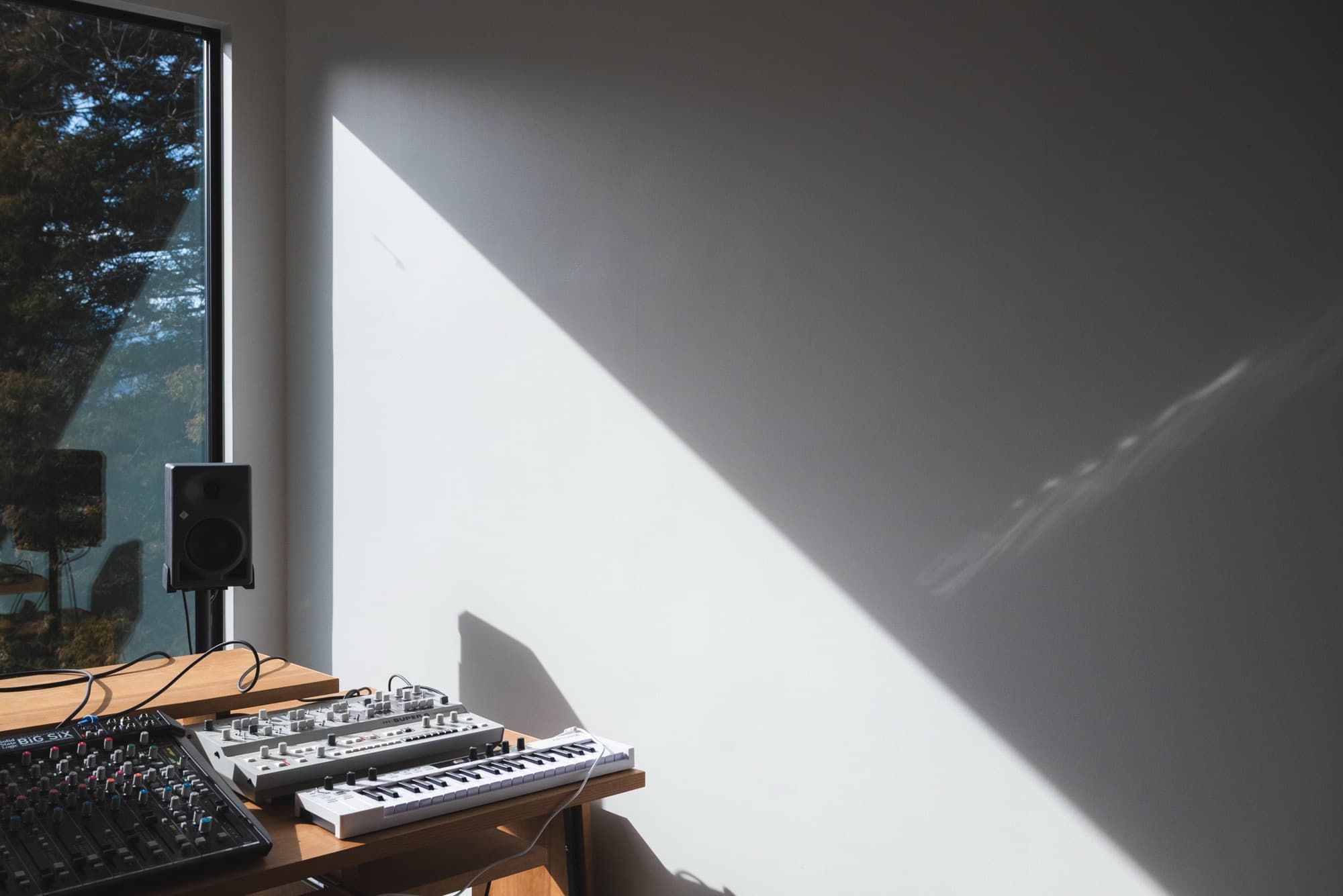 Studio room at inou studio with SSL Big Six and synthesizers by the window